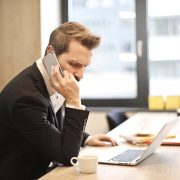 Man on phone and laptop
